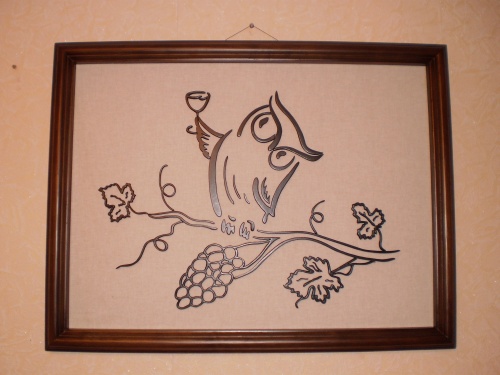 Сова на виноградной лозе